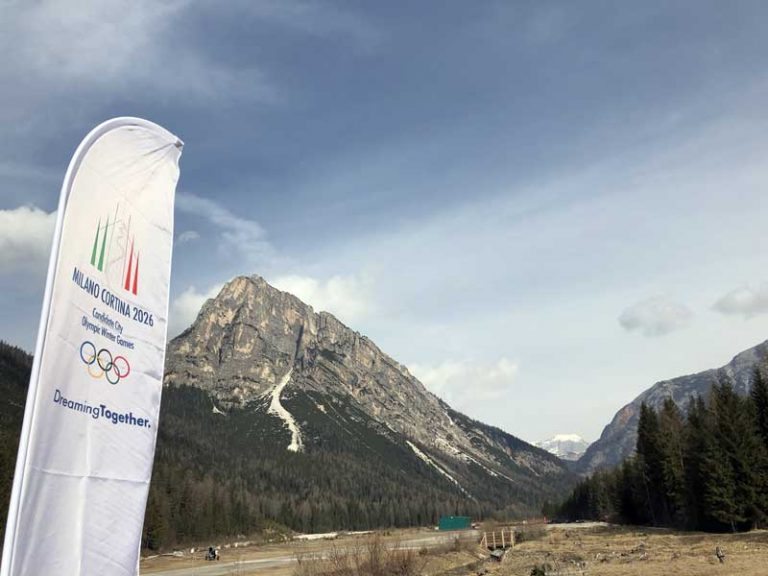 Milan-Cortina 2026 Winter Olympic Bid banner at site of proposed Olympic Village in Cortina d'Ampezzo (GamesBids Photo)