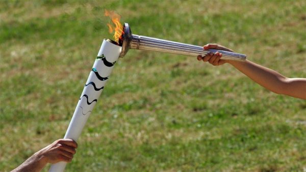 The Olympic Flame is passed to the Rio 2016 Organizing Committee at Olympia, Greece (IOC Photo)